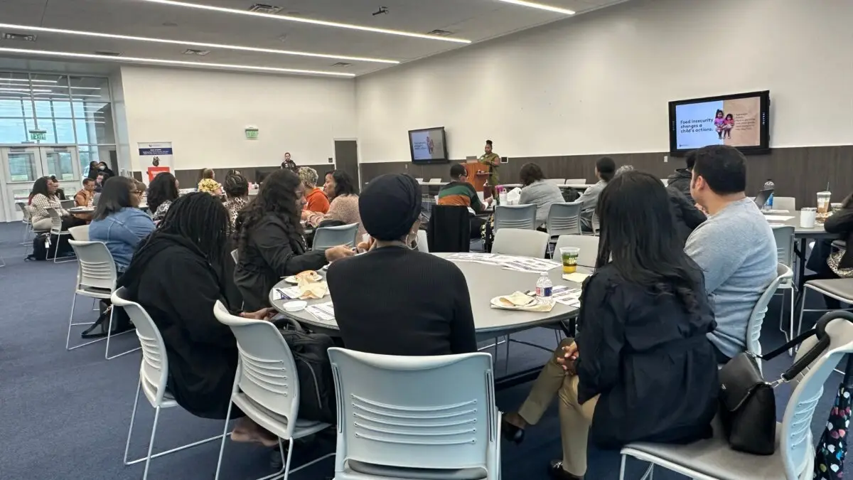 EHCTX LINK participants sharing ideas around meeting tables.