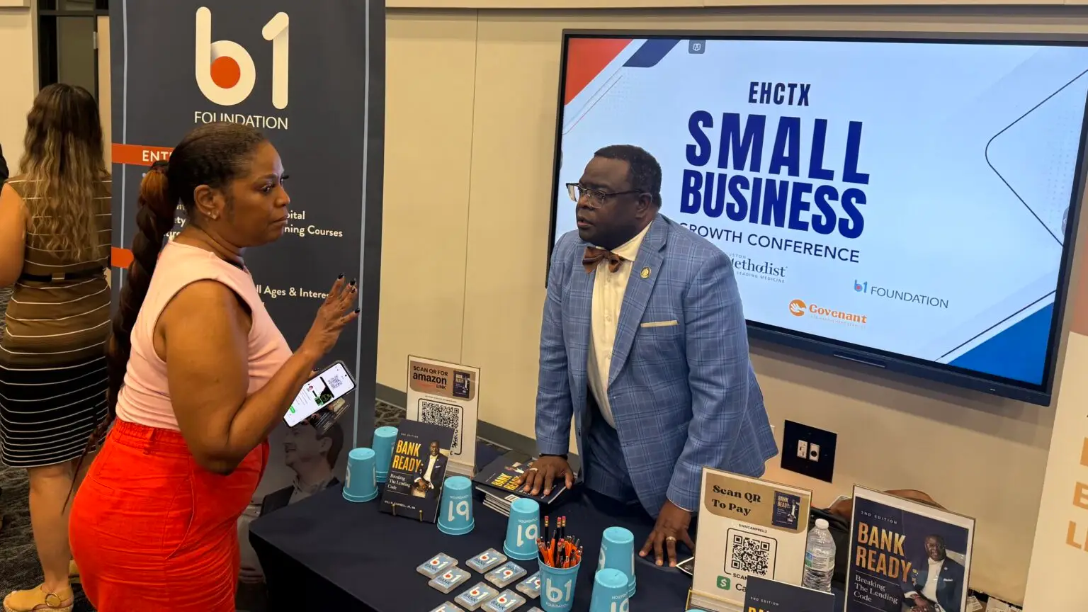 A conversation at a community resource table
